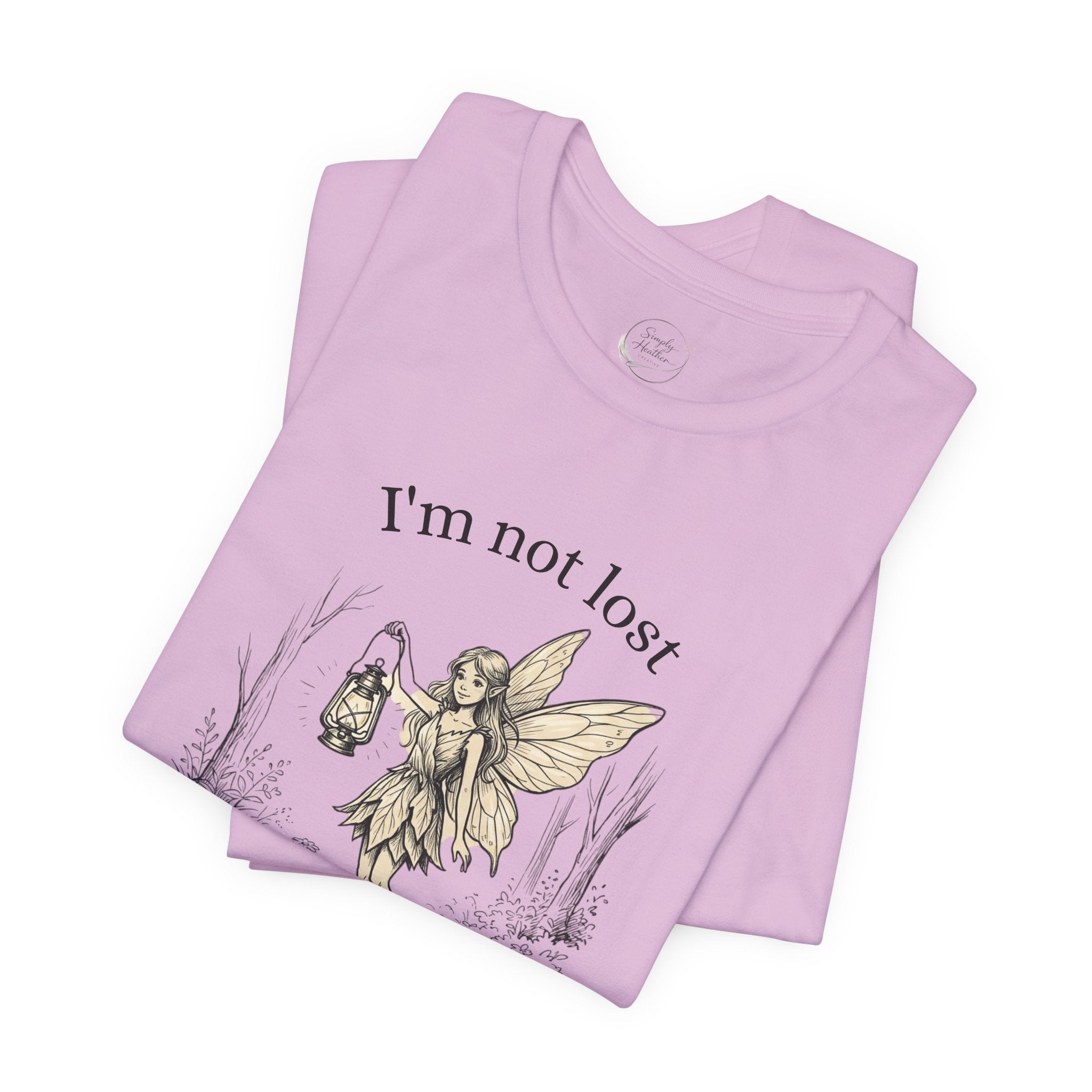 Fairy Exploration Tee by Printify featuring a graphic design with the text "I’m Not Lost, I’m Exploring" on a casual T-shirt.