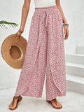 Whisperwind Tied Wide-Leg Pants by Trendsi featuring a dreamy printed flow design and relaxed fit, shown in a stylish full-length view.