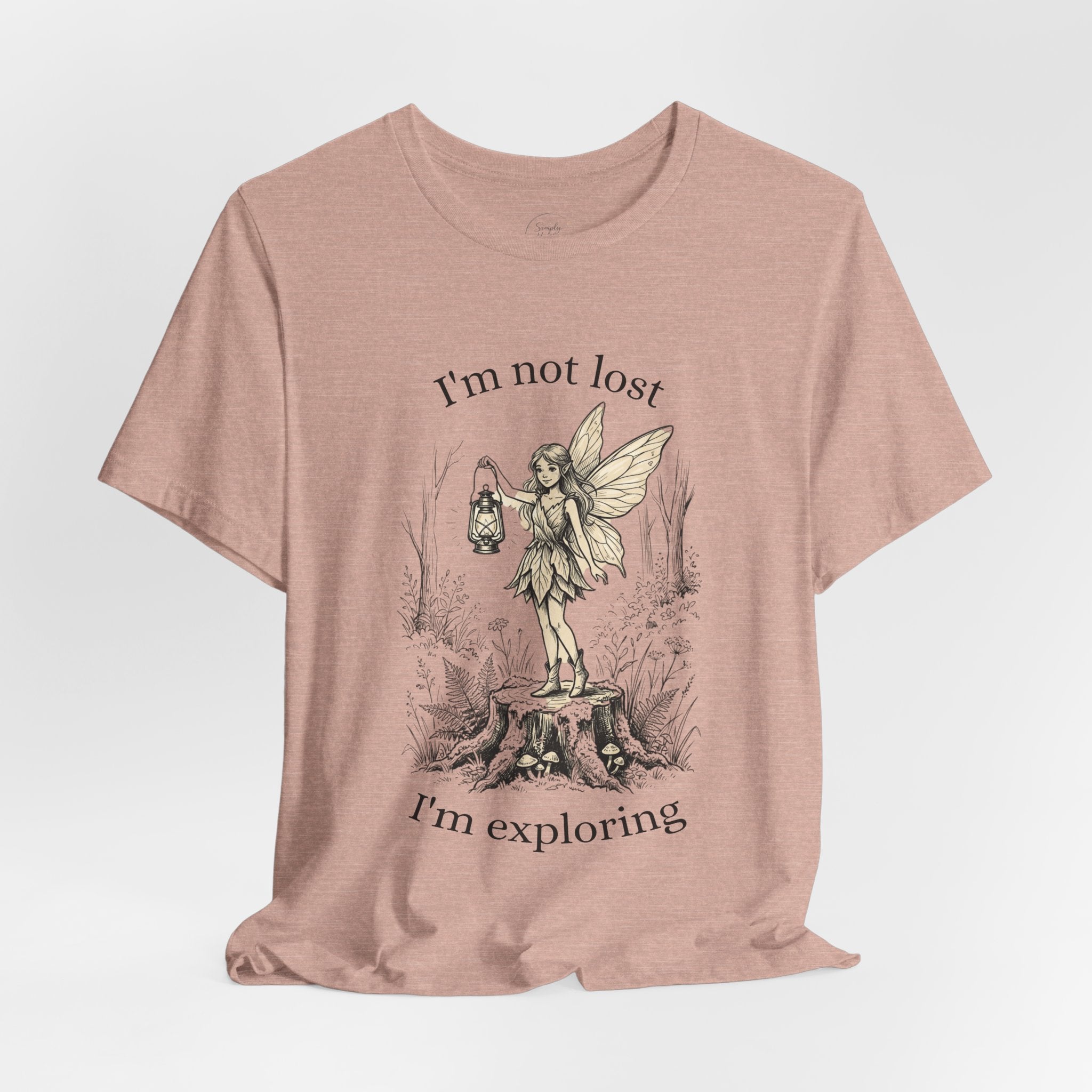 Fairy Exploration Tee graphic T-shirt with "I’m Not Lost, I’m Exploring" text, featuring whimsical fairy artwork by Printify.