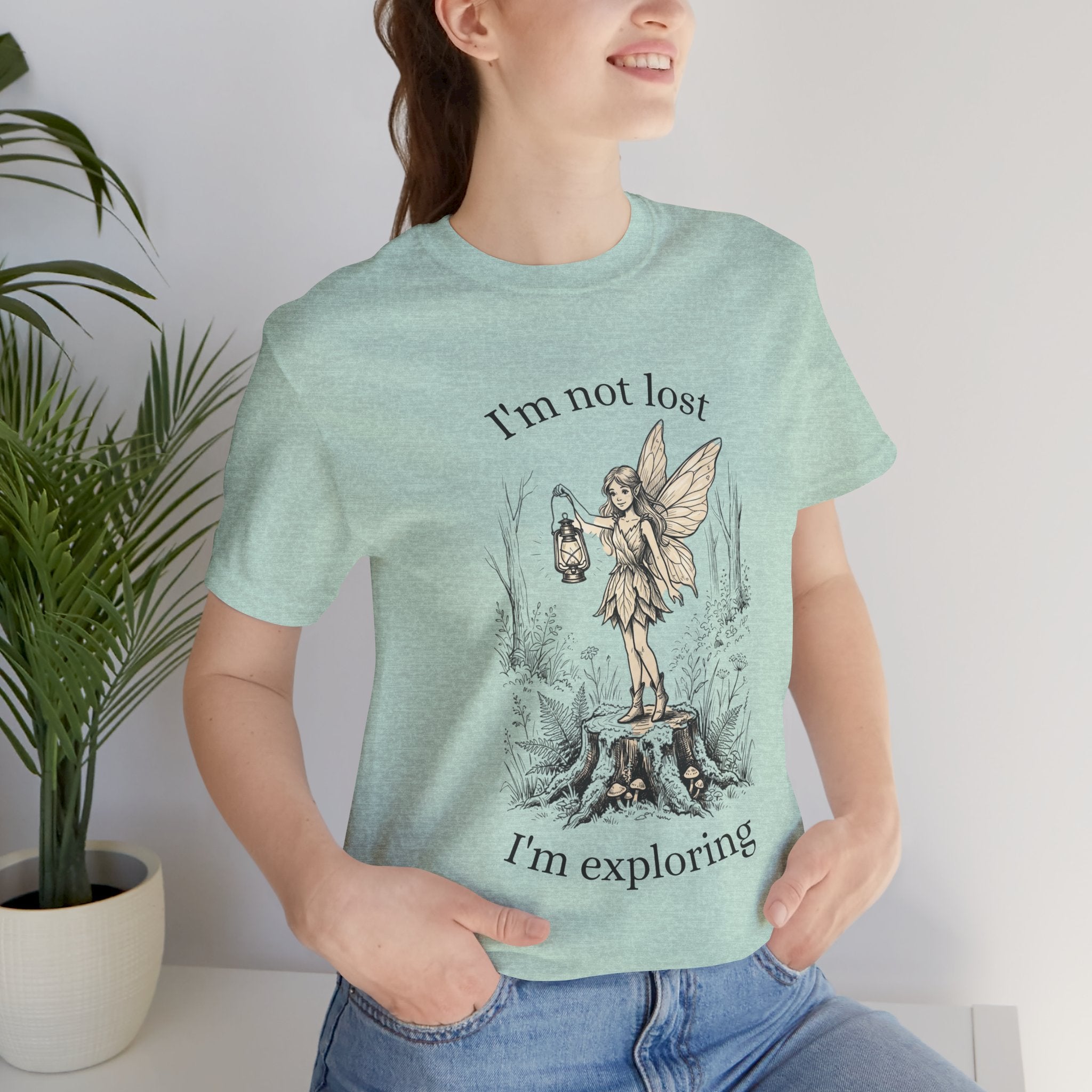Fairy Exploration T-shirt by Printify featuring a graphic design with the text "I’m Not Lost, I’m Exploring" on a casual cotton tee.