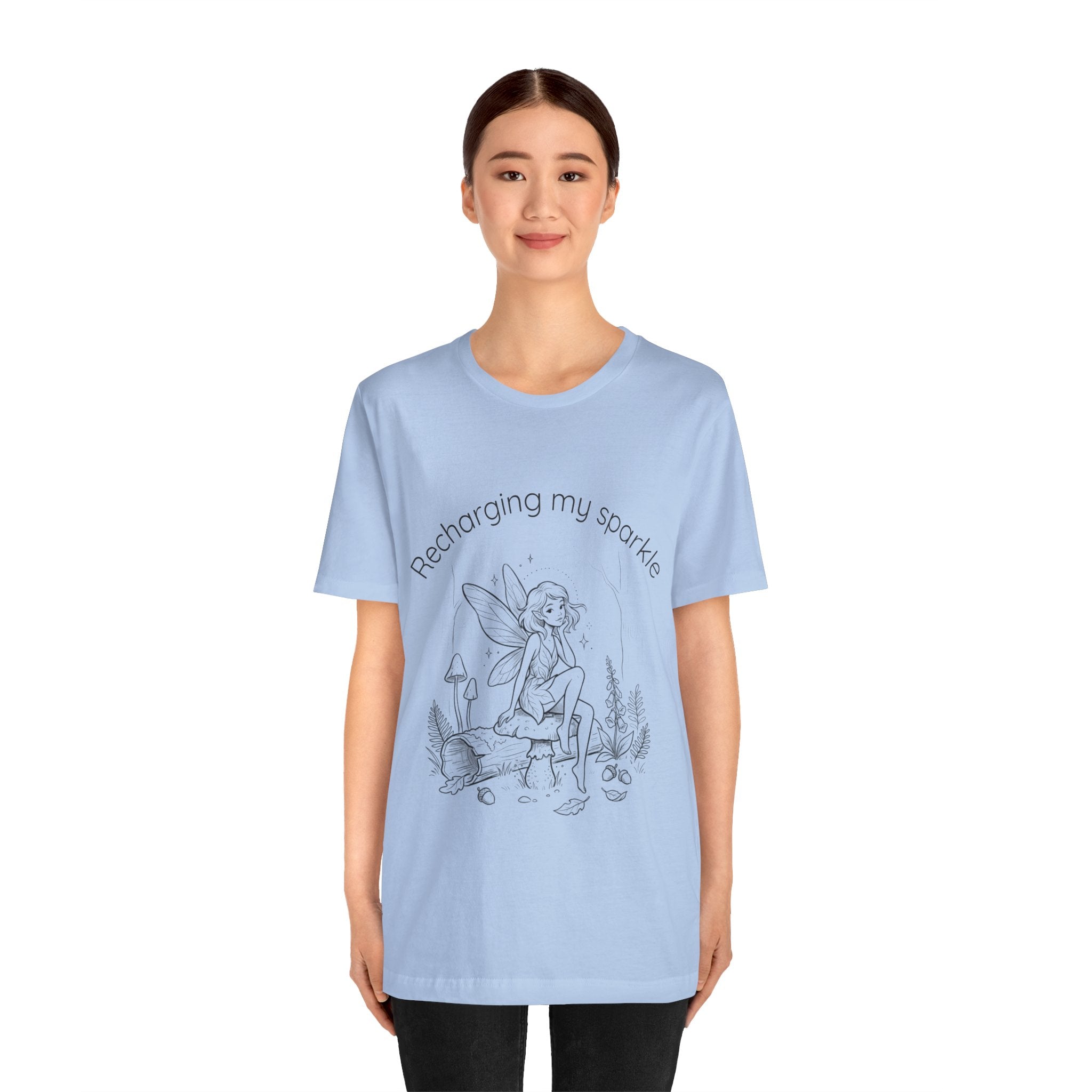 Vintage fairy graphic T-shirt by Printify featuring the phrase "Recharging My Sparkle" on a casual, colorful tee.