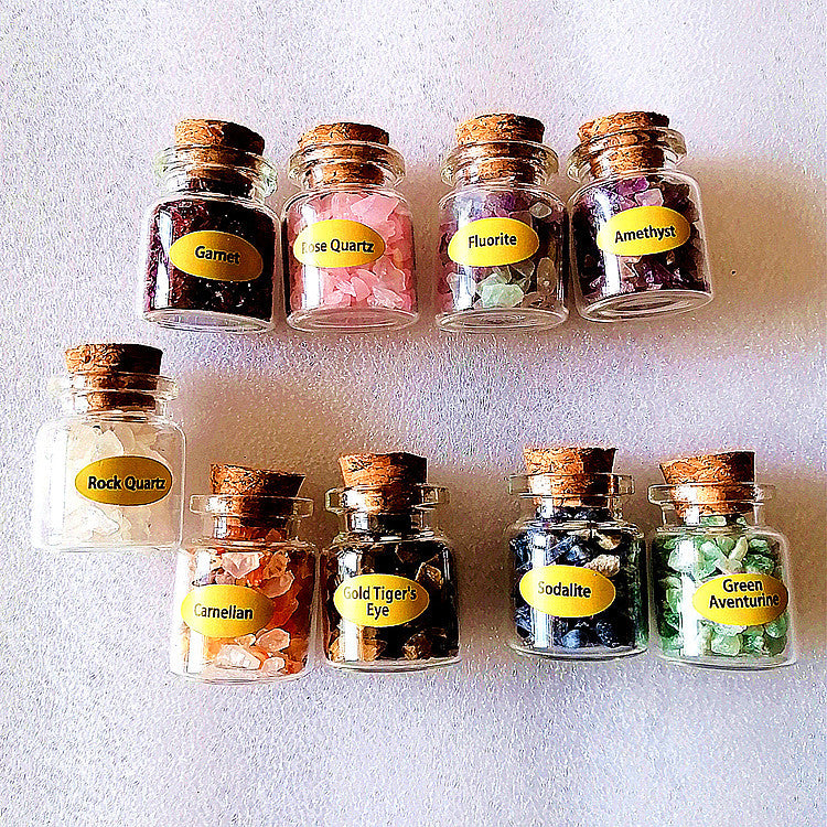 Mini wishing bottles with crushed crystal stones from 24 Hour Crafts, featuring small glass bottles filled with colorful crushed crystals.