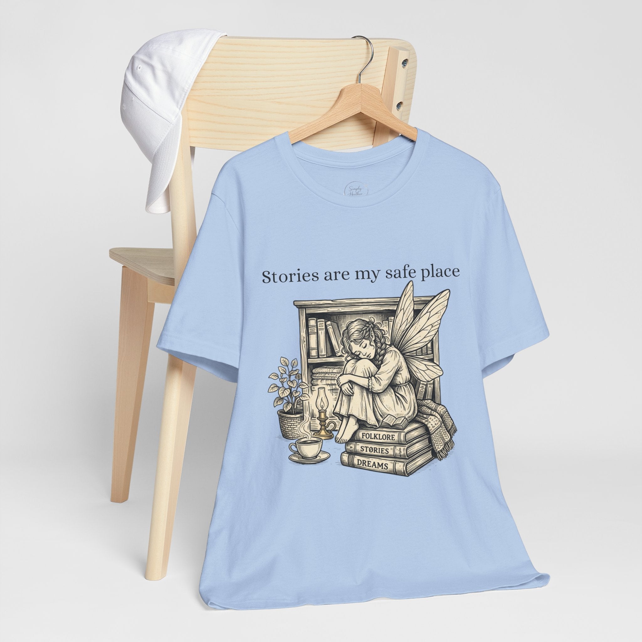 Fairy reading booklover T-shirt featuring "Stories Are My Safe Place" print, casual cotton tee for book enthusiasts