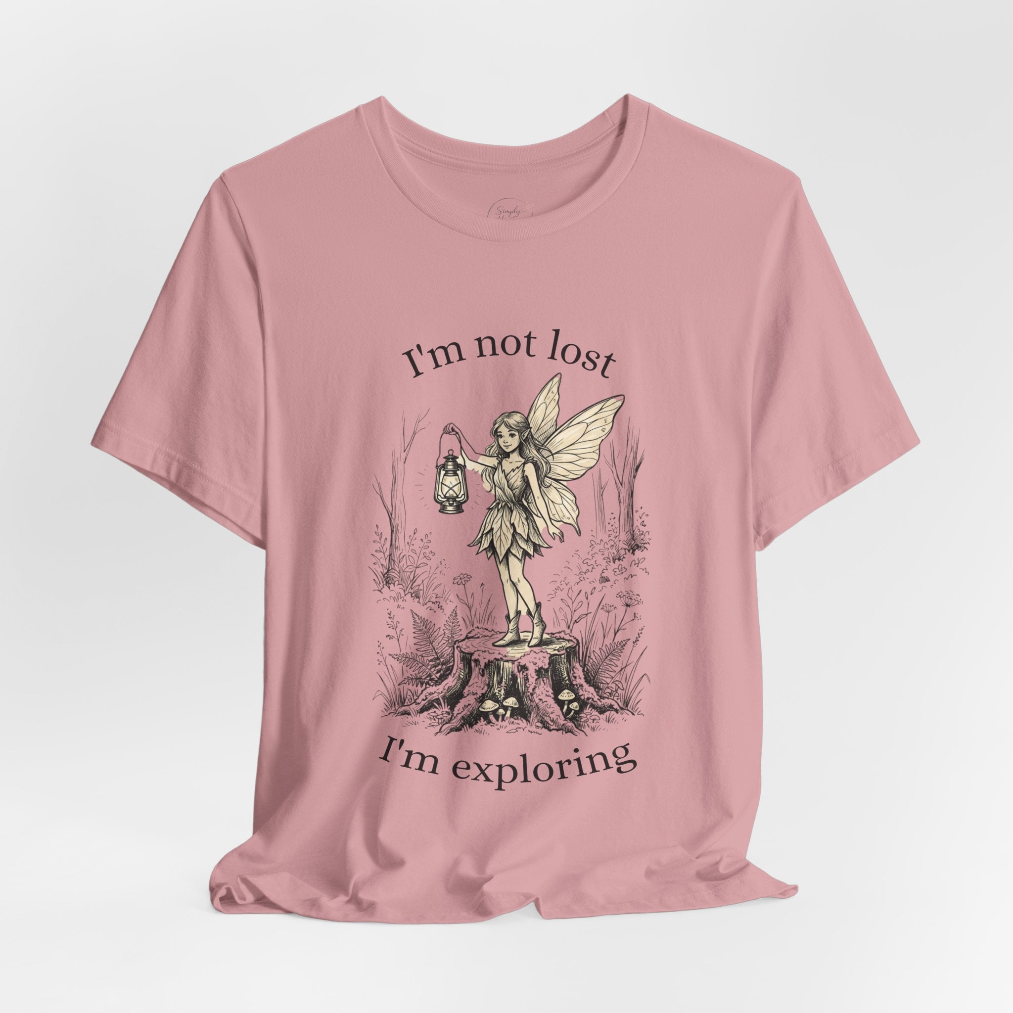 Graphic T-shirt for women with fairy exploration theme, featuring the text "I’m Not Lost, I’m Exploring" on a stylish Printify tee.