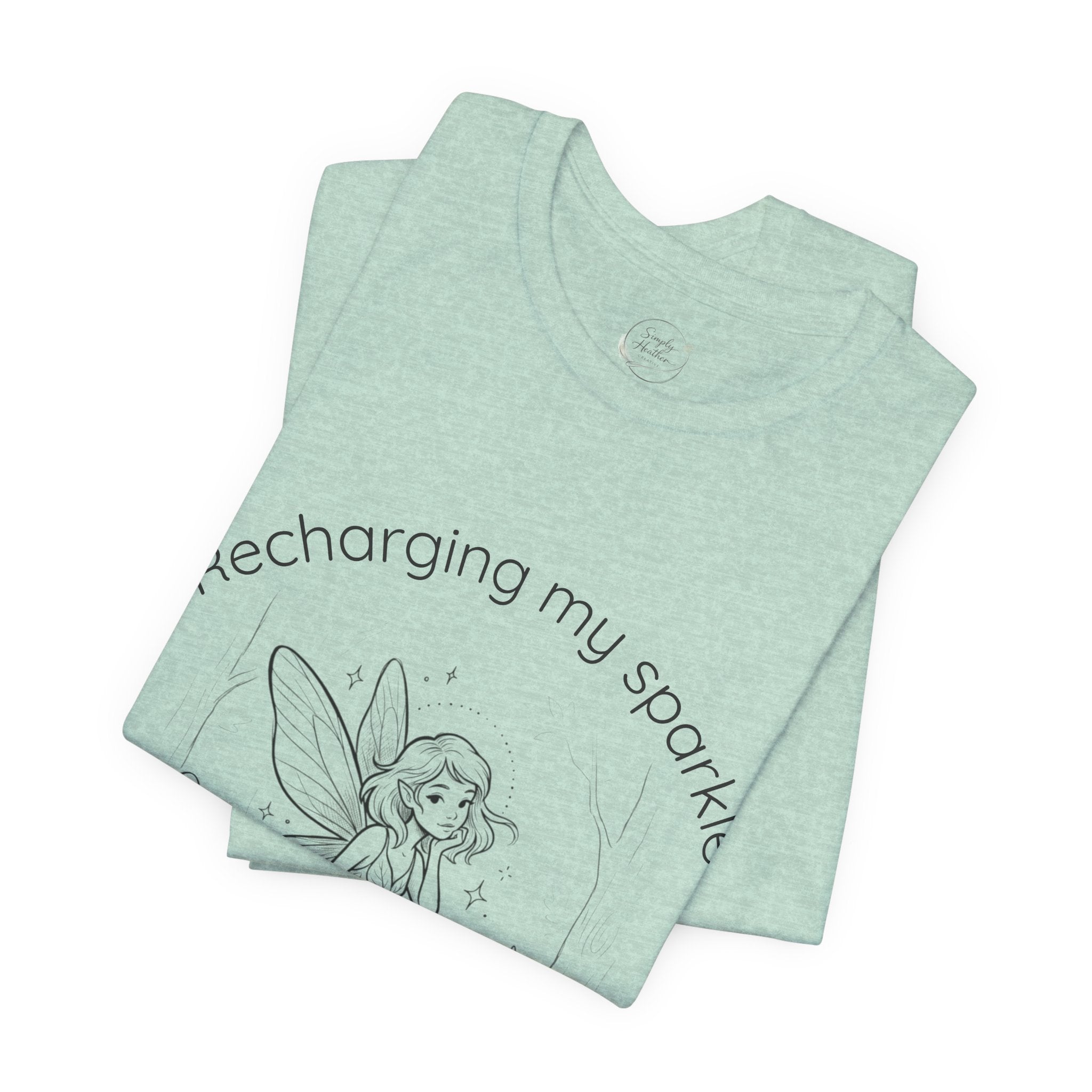 Vintage fairy graphic T-shirt with "Recharging My Sparkle" slogan, featuring colorful fairy illustration on a casual print T-shirt.