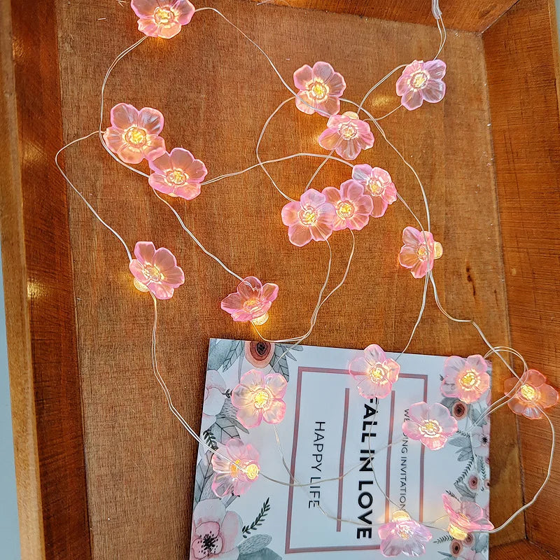 Cherry blossom fairy string lights with 20 LED soft glow garland, ideal for home decor and holiday lighting by Simply Heather Creative.