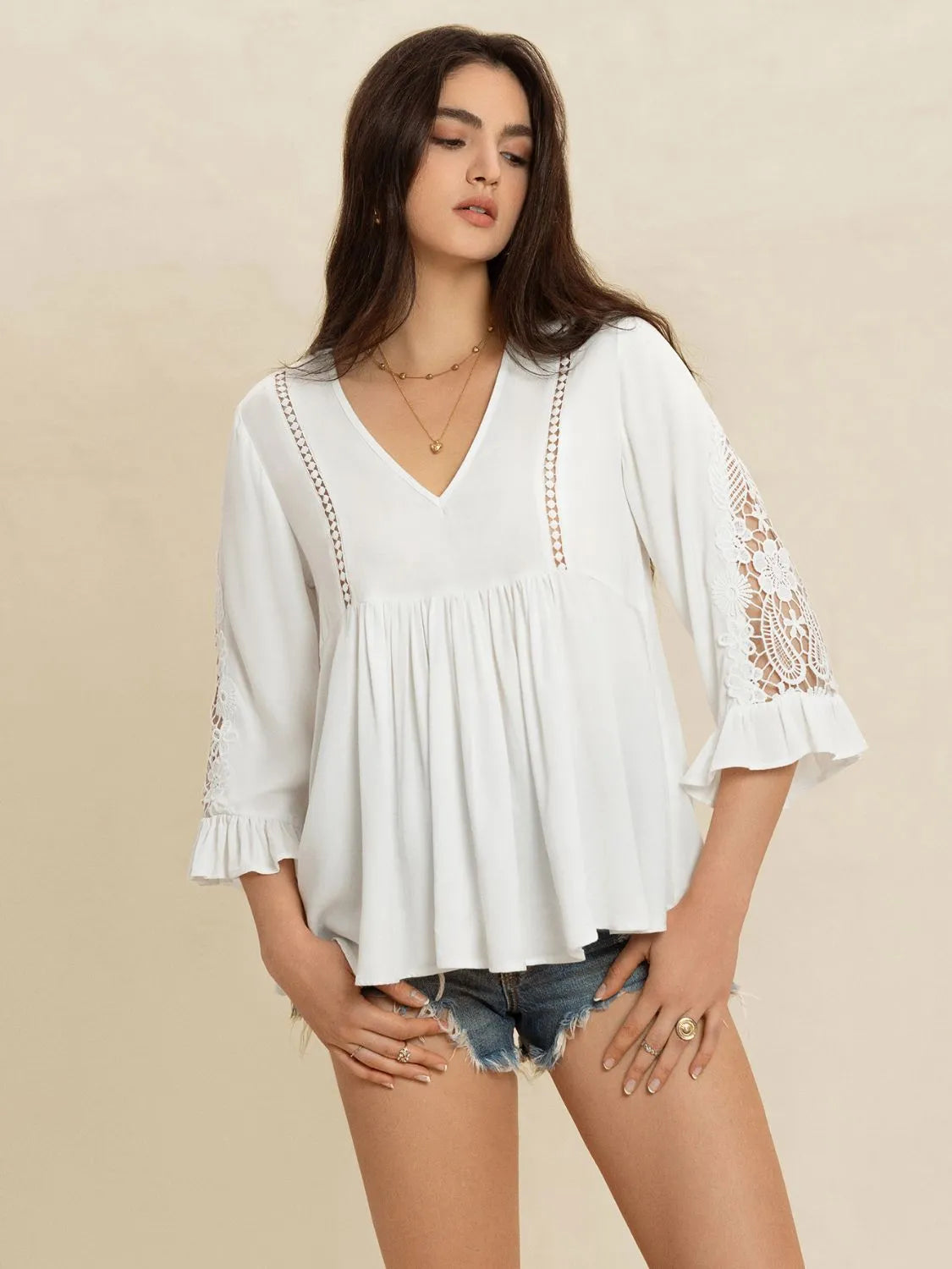 White lace blouse with flounce sleeves and V-neck, featuring a romantic cottage-inspired design by Trendsi.