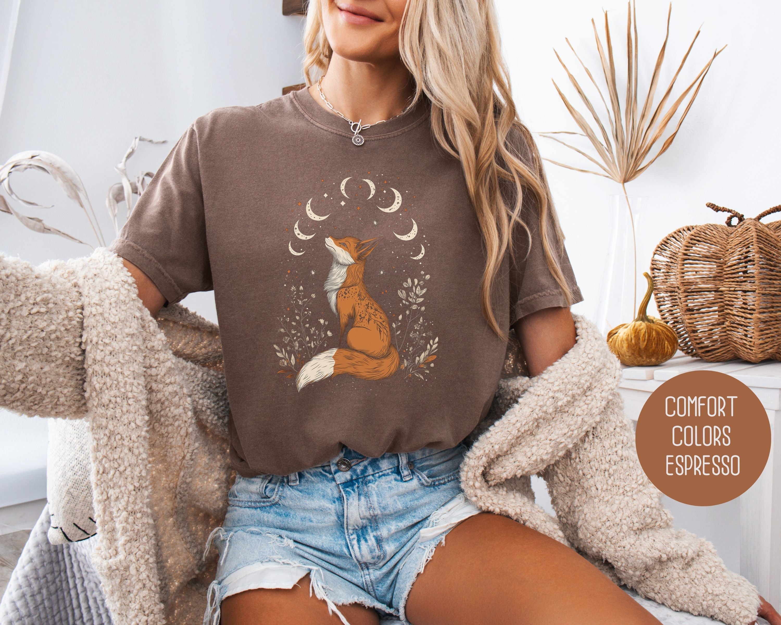 Cream-colored Celestial Fox Cottagecore T-shirt by CreativeSpecialTs featuring a whimsical fox and celestial design on soft cotton fabric.