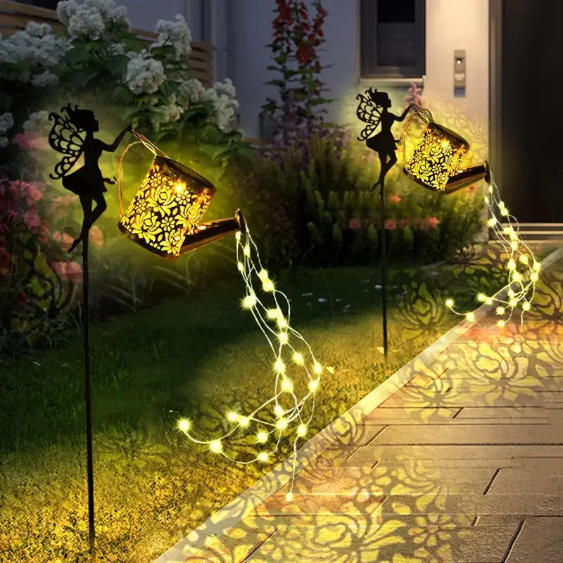 Fairy Watering Can Garden Light by Simply Heather Creative, a charming yard ornament with a fairy-themed watering can design.