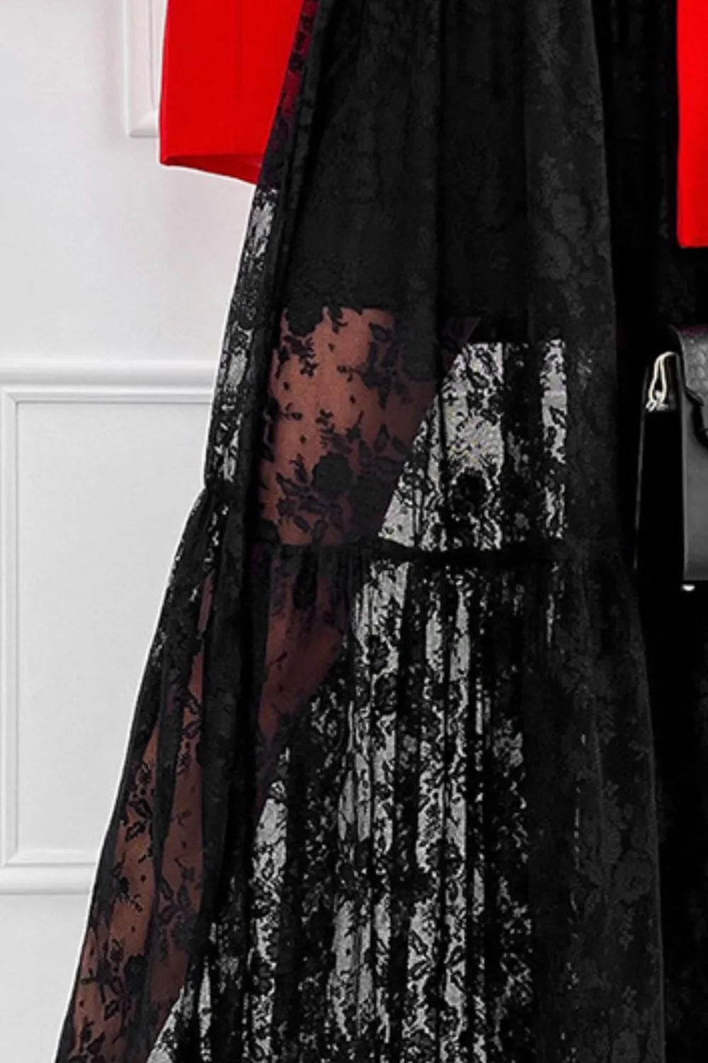 Close-up of black Lace Dream Maxi Skirt by Trendsi, showing intricate lace detail and elastic waistband.