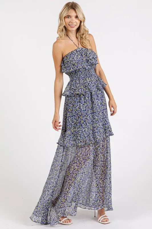 Navy floral ruffle halter dress by Trendsi showing front view with ruffled neckline and halter straps on a dress form.