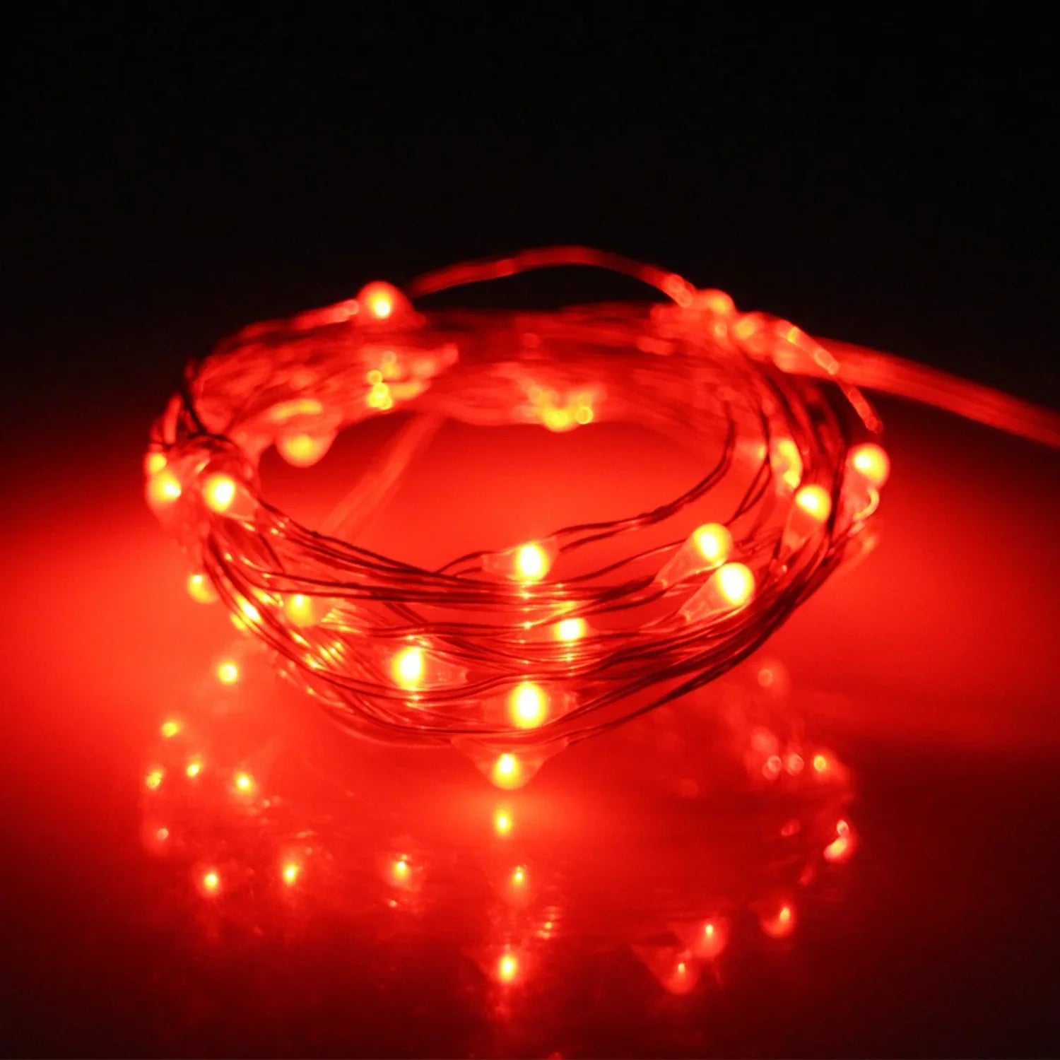 Orange amber glow LED fairy lights with 20 silver copper LED bulbs, battery operated, perfect for decorative lighting.