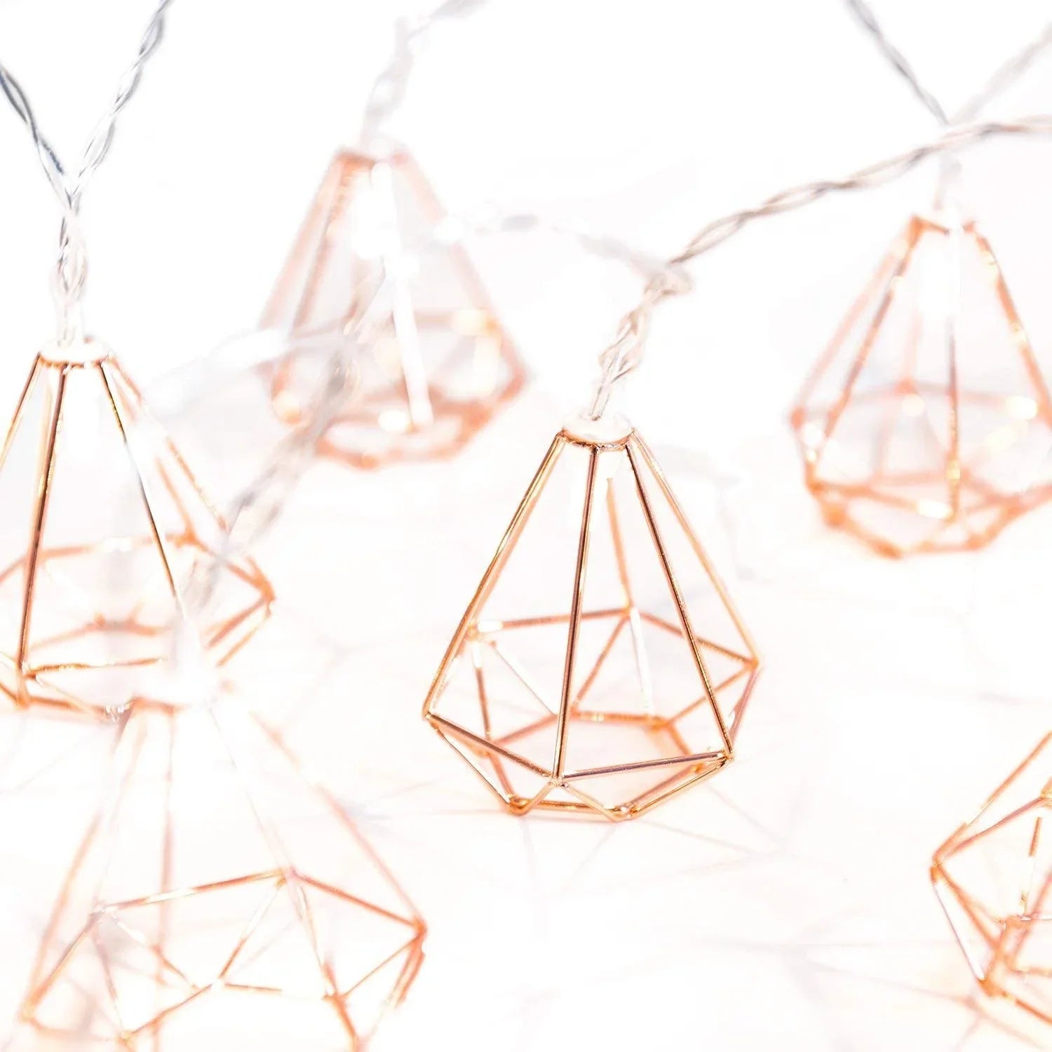 Rose gold diamond-shaped LED string fairy lights with warm white LEDs, battery operated, perfect for holiday or decorative use.