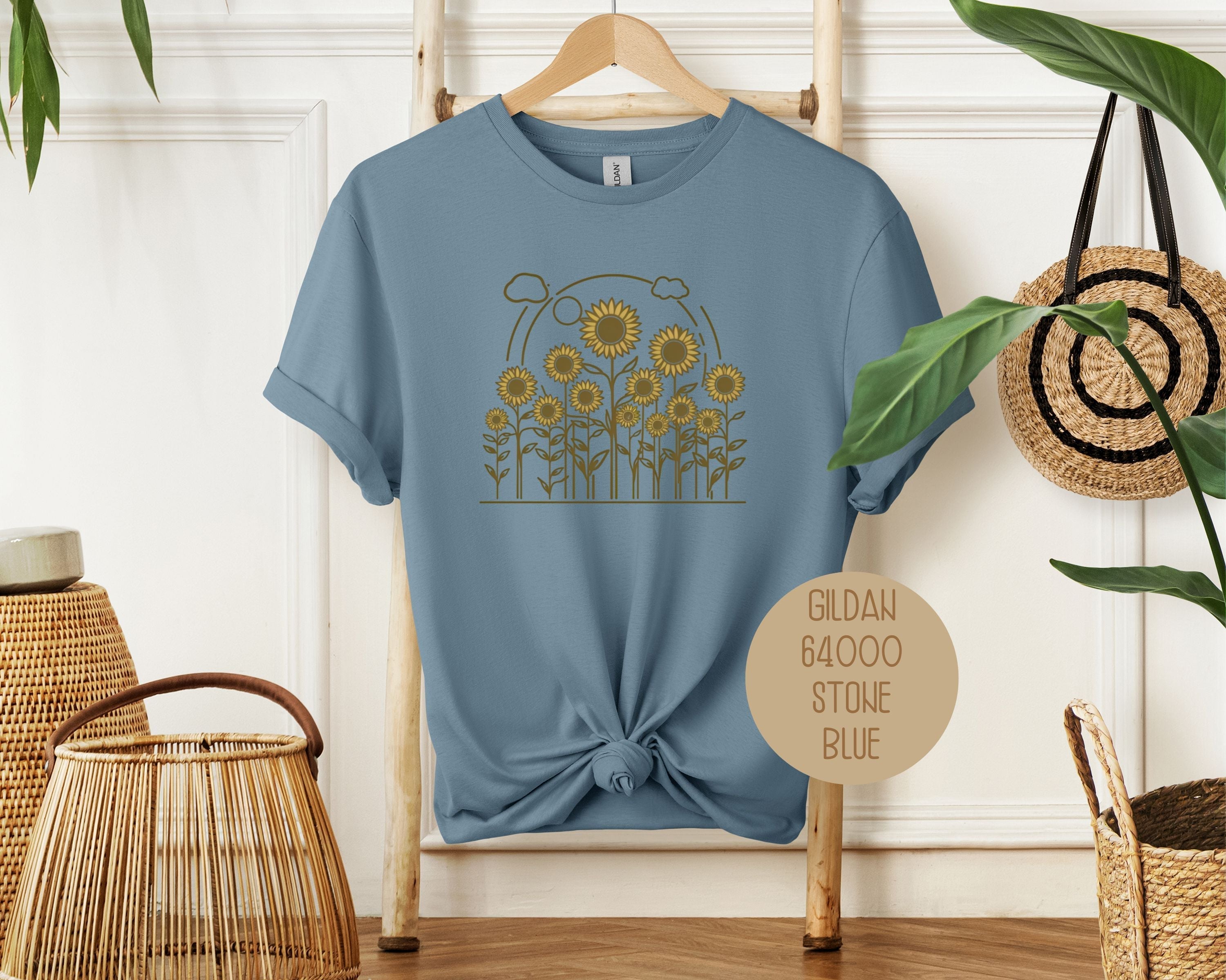 Stone blue Rosehaven Cottage vintage sunflower T-shirt by CreativeSpecialTs, featuring a front view with sunflower design.
