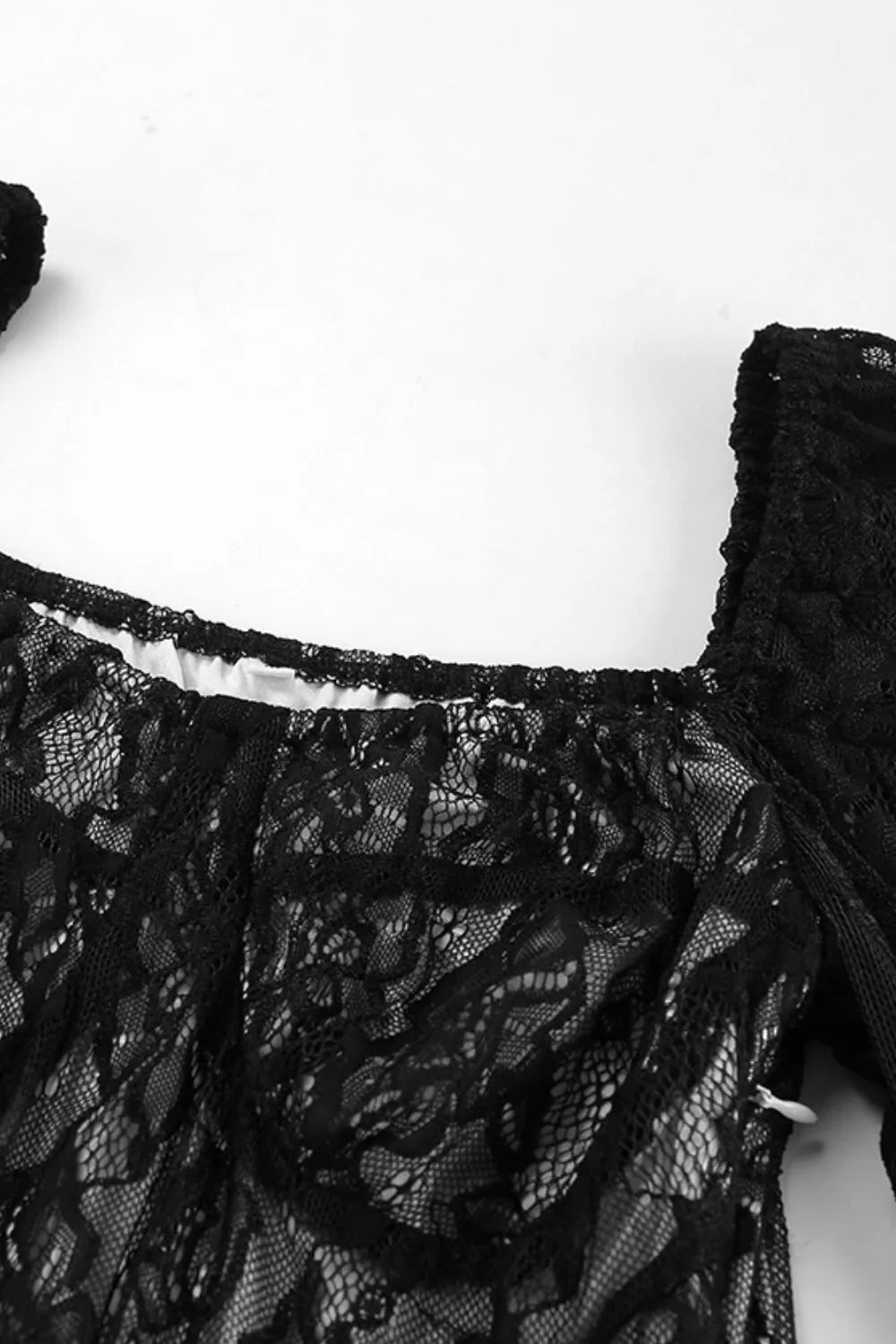 Close-up of the bodice detail on the Starlit Hollow Lace Spell Dress, showcasing intricate lace patterns and elegant design.