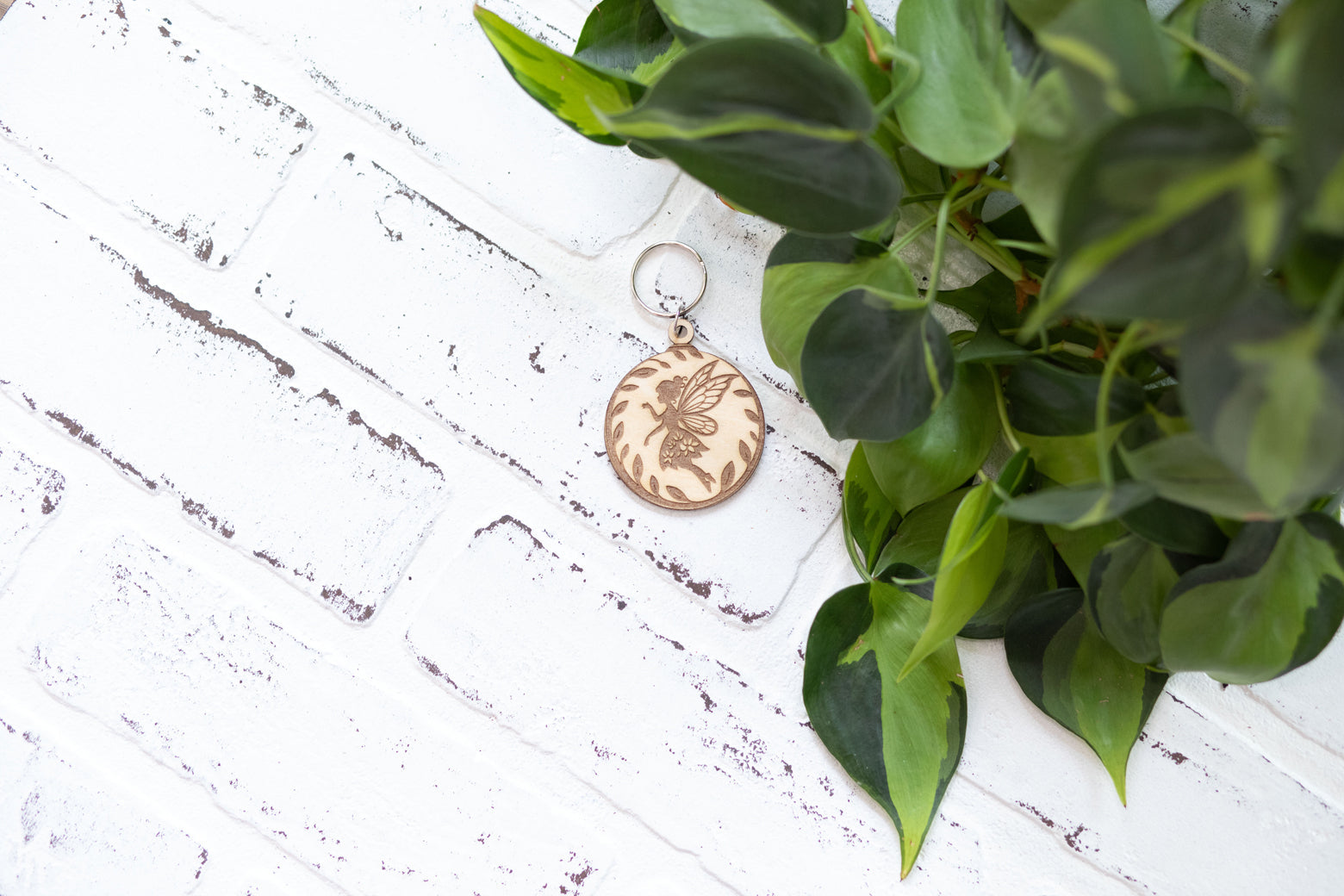 Wooden fairy keychain from The McGarvey Workshop featuring an enchanted forest charm on a keyring.