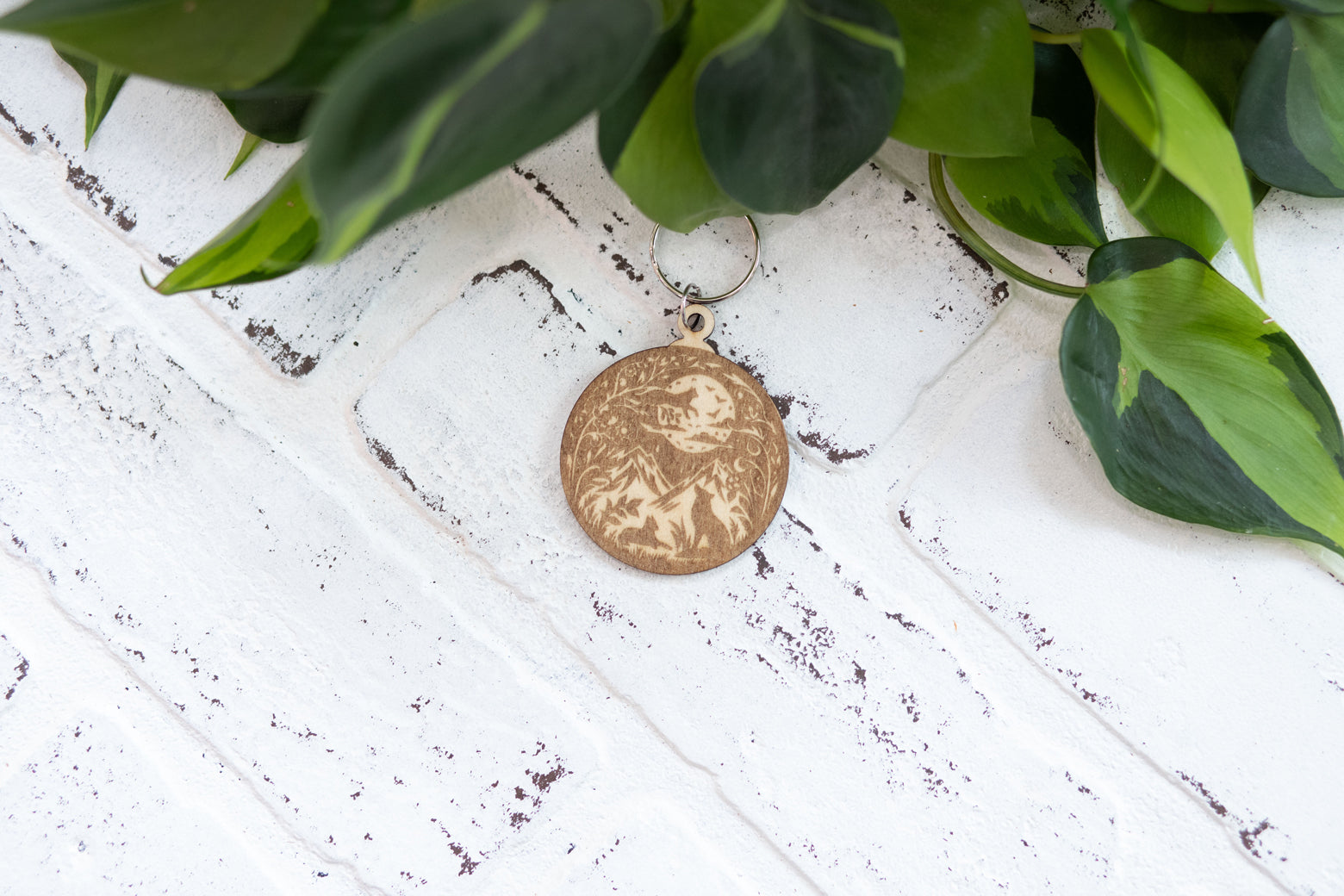 Wooden fairy keychain from The McGarvey Workshop featuring a whimsical enchanted forest charm, with detailed fairy design.