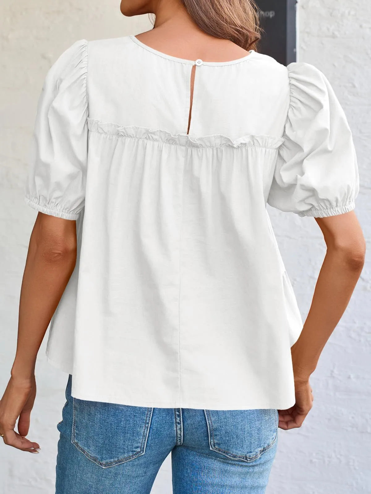 Soft Meadow Silhouette puff sleeve tiered cottage blouse by Trendsi, featuring ruffled sleeves and a flowy, feminine design.