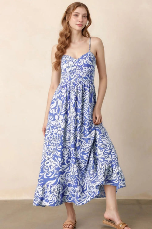 Whimsical blue spaghetti strap sundress featuring a flowy design, modeled from the front, perfect for casual summer wear.