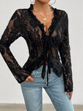 Black lace tied V-neck blouse with sheer sleeves, stylish front view, from Trendsi.