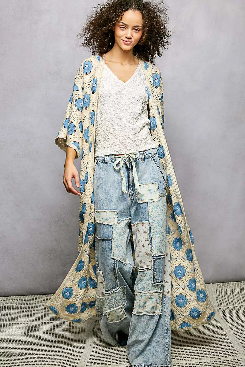 Rosehaven Crochet Garden Cardigan by Trendsi, featuring intricate crochet details and a soft, lightweight knit in a floral design.