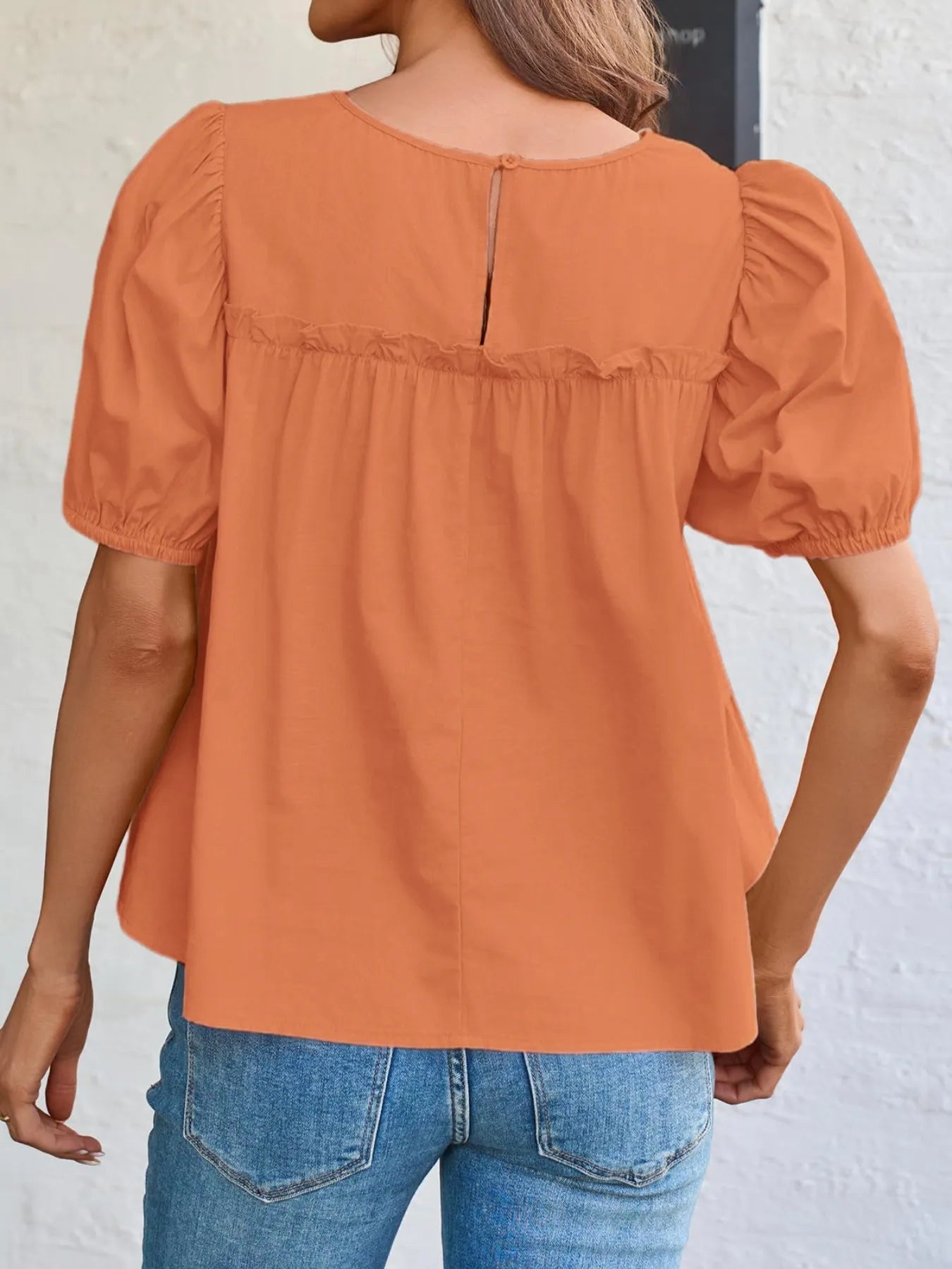 Soft Meadow Silhouette puff sleeve tiered cottage blouse by Trendsi, featuring a feminine design with ruffled tiers and puffed sleeves.