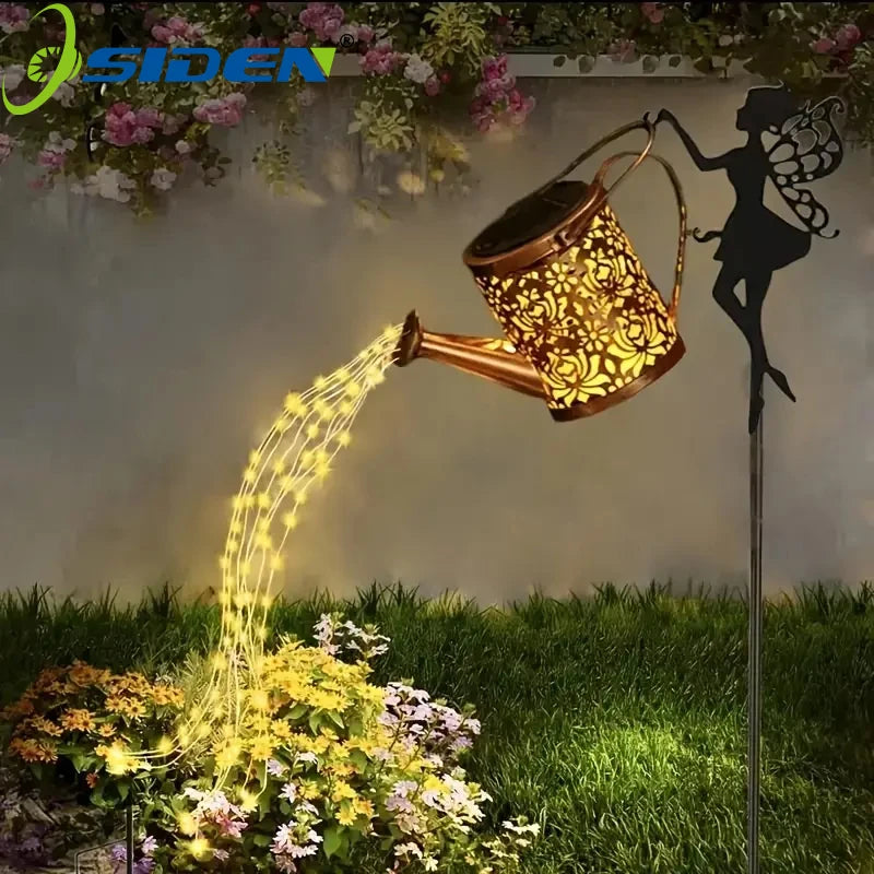 Close-up of Simply Heather Creative fairy watering can garden light, a charming yard ornament with whimsical fairy design.