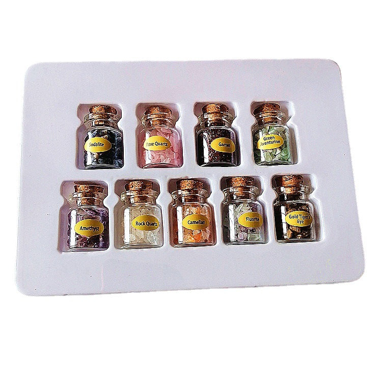 Mini wishing bottles with crushed crystal stones from 24 Hour Crafts, featuring tiny glass bottles and colorful crushed crystals inside.