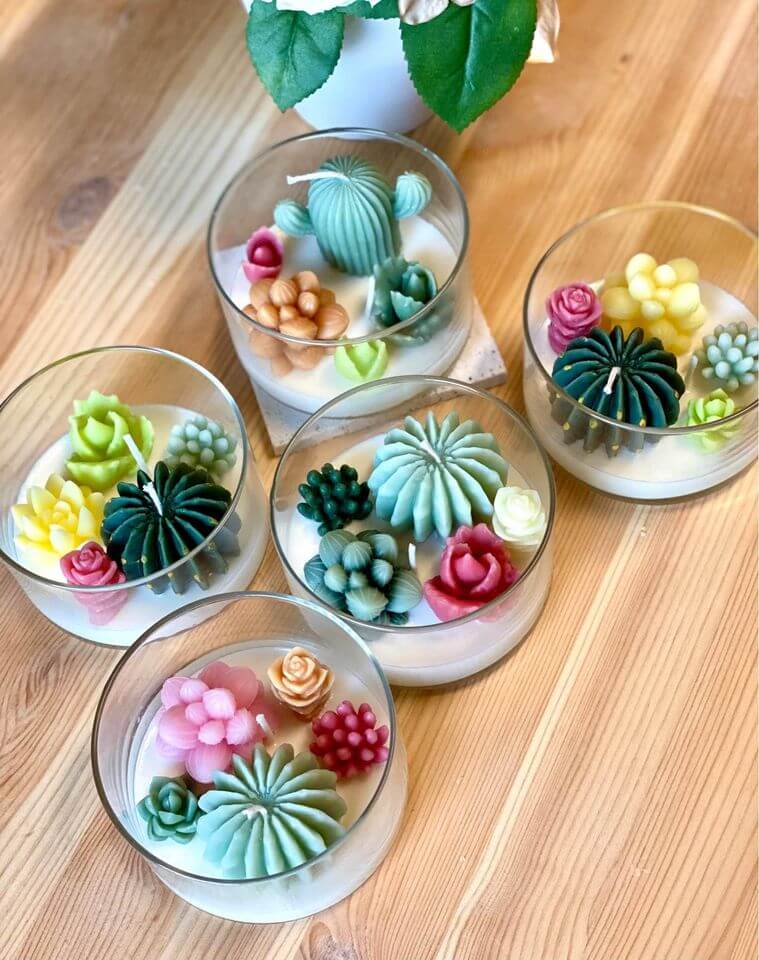 Handmade garden terrarium candle by Crazy About Candles with lush greenery and serene glow, perfect for home decor.
