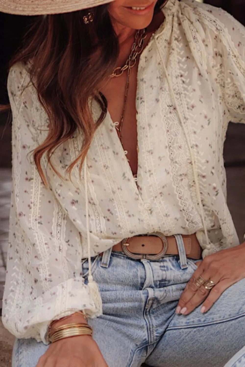 Front view of a Meadow Lace and Frill Tie-Neck Blouse by Trendsi featuring lace details and a tie-neck design.