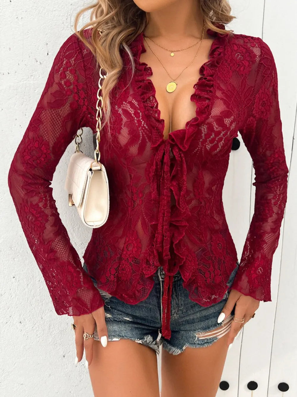 Lipstick-red lace-tied V-neck blouse with sheer sleeves, stylish front view, by Trendsi, perfect for elegant casual wear.