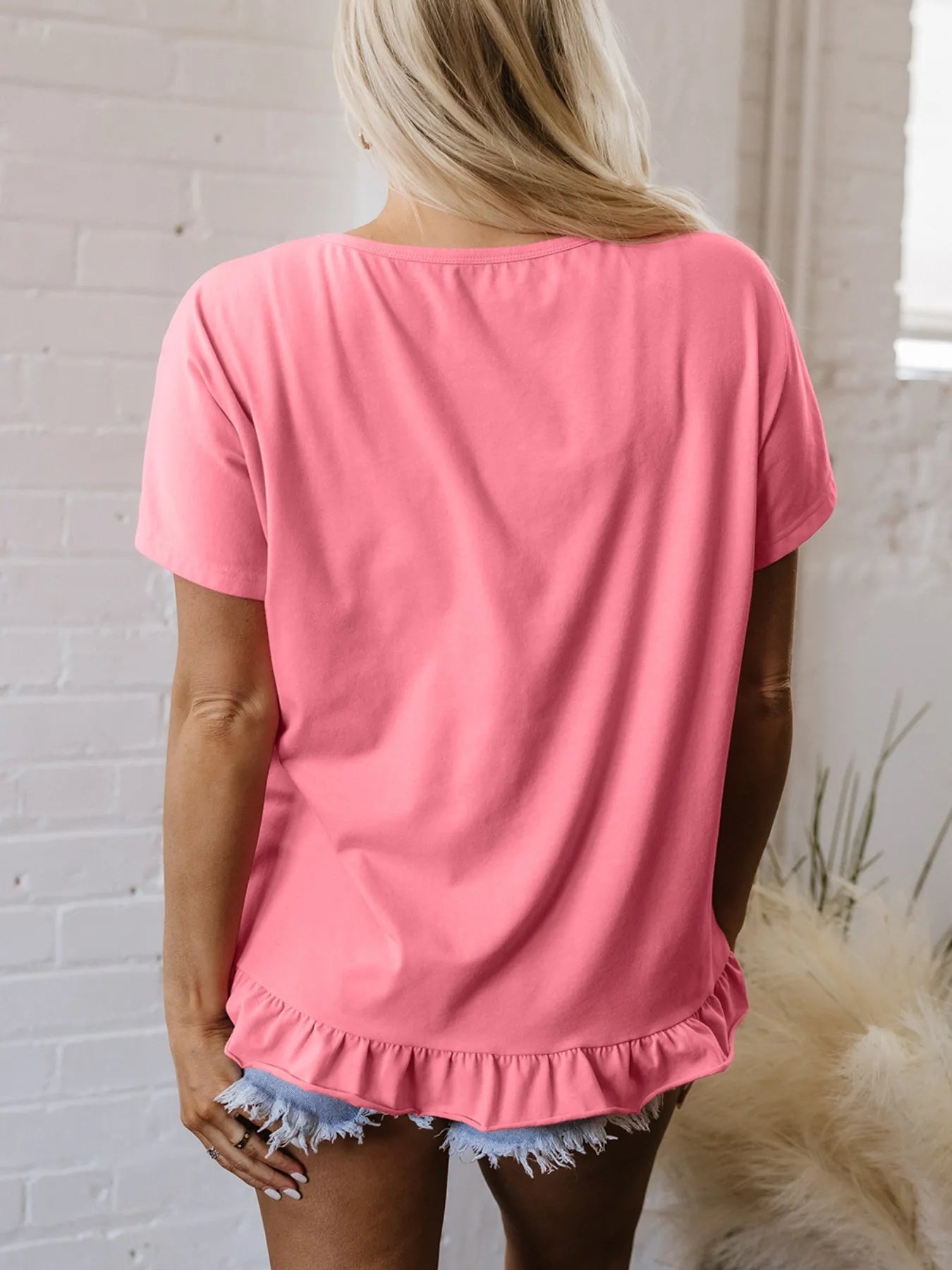 Pale blush ruffle-hem cottage T-shirt with round neckline and back view, casual trendy top by Trendsi.