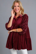 Light pink Starlit Wine Sequin Tiered Back Blouse by Trendsi, featuring shimmering sequins and a layered tiered design.