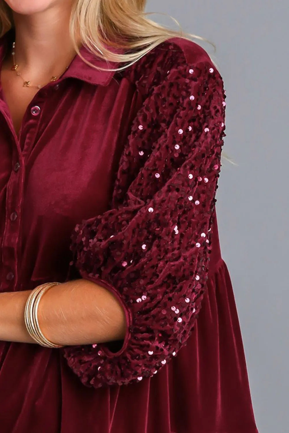 Sequin tiered back blouse with long sleeves, featuring a shimmering starlit design and stylish layered fabric.