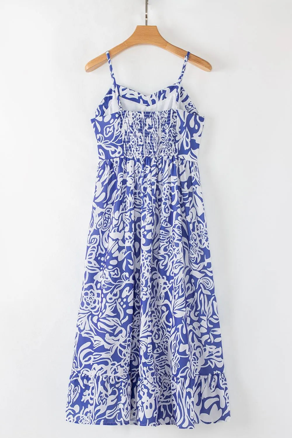 Bluebell Reverie sundress by Trendsi featuring whimsical spaghetti straps and a back hanger design, perfect for warm weather wear.