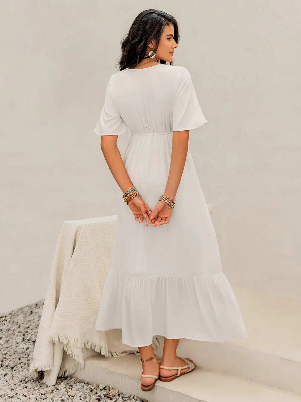 White Briar Cottage Dress by Trendsi, back view showing flowy fabric and relaxed fit on a model.