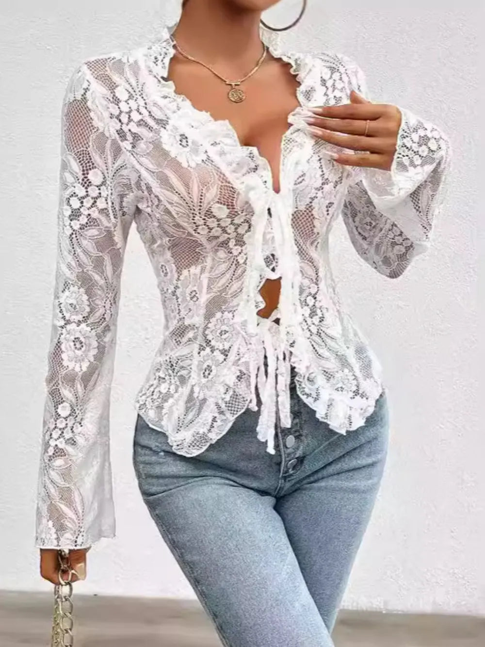 White lace-tied V-neck blouse with sheer long sleeves, stylish and elegant, from Trendsi.